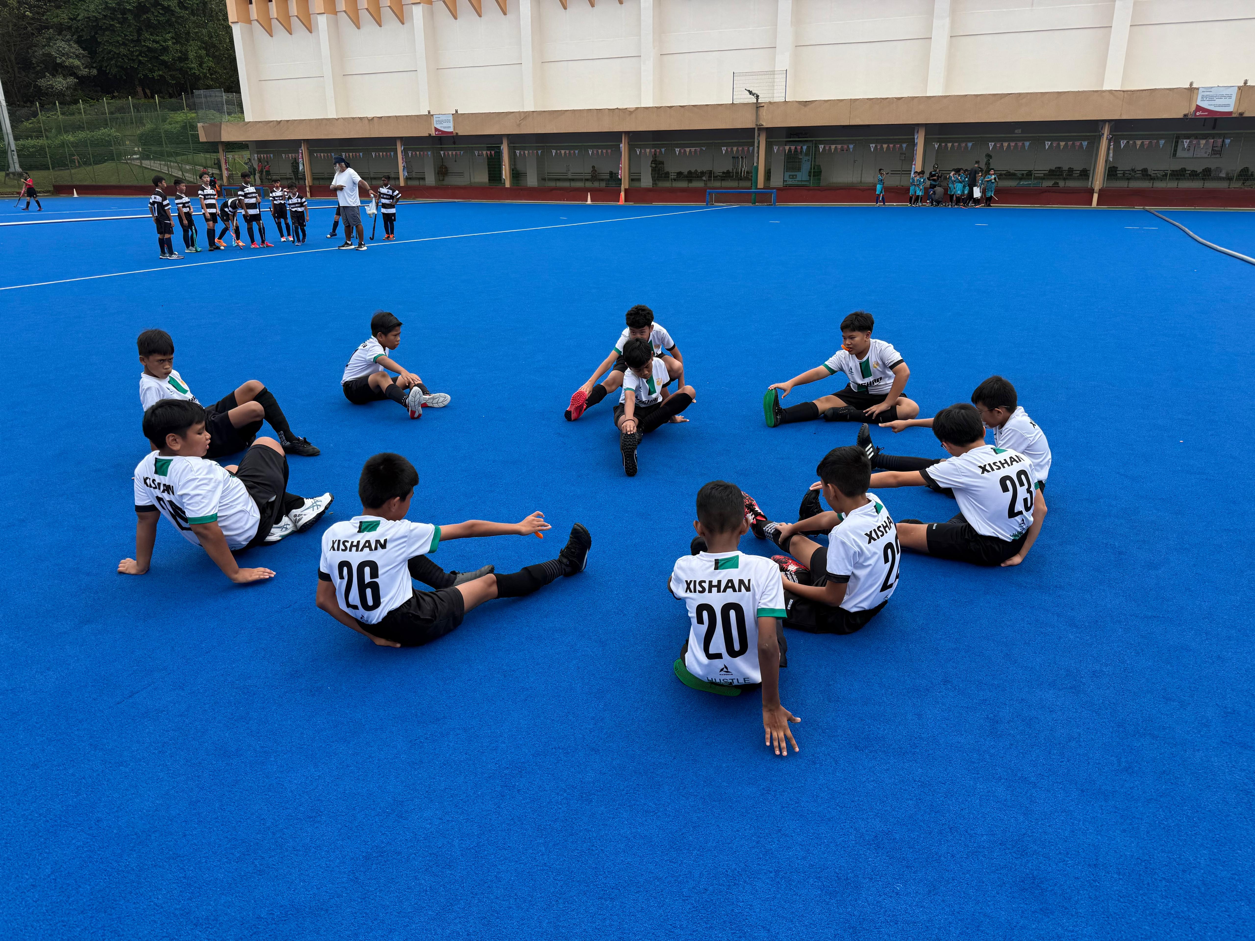 The P5 Hockey Boys warming up for their National School Games.
