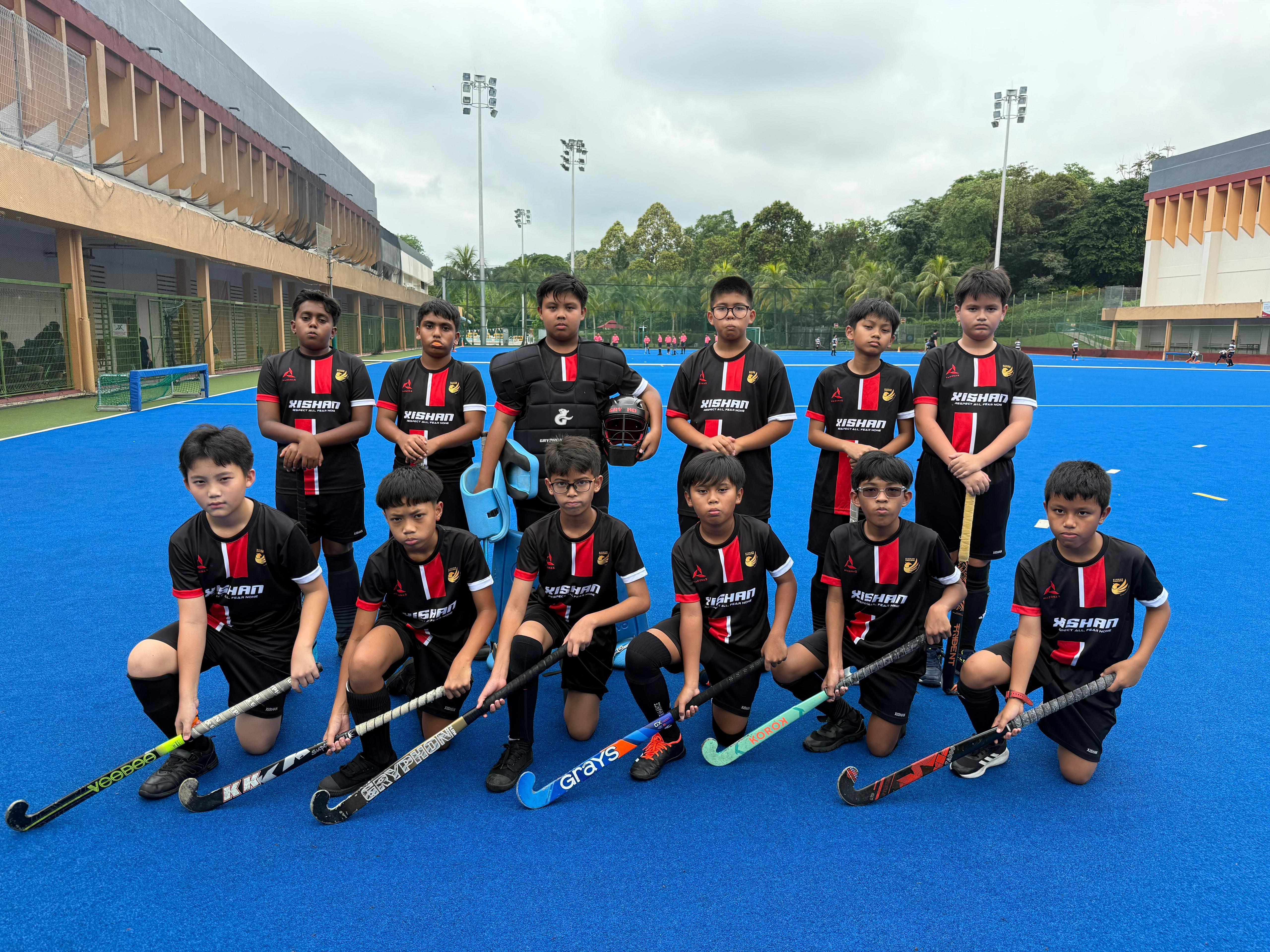 Our Senior Hockey Boys (P6) participating in the National School Games.