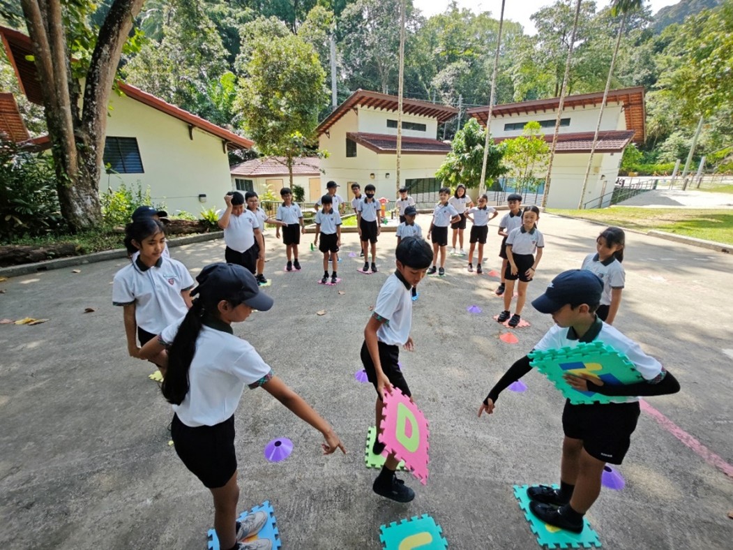 Students working on their communication and collaboration skills through teambuilding games